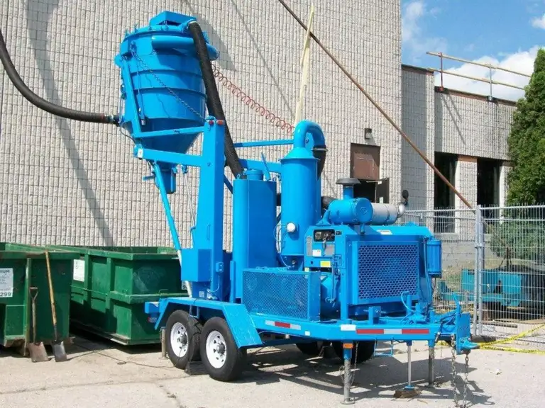 Debris and gravel collected on a Barrie roofing site by Vacaroof
